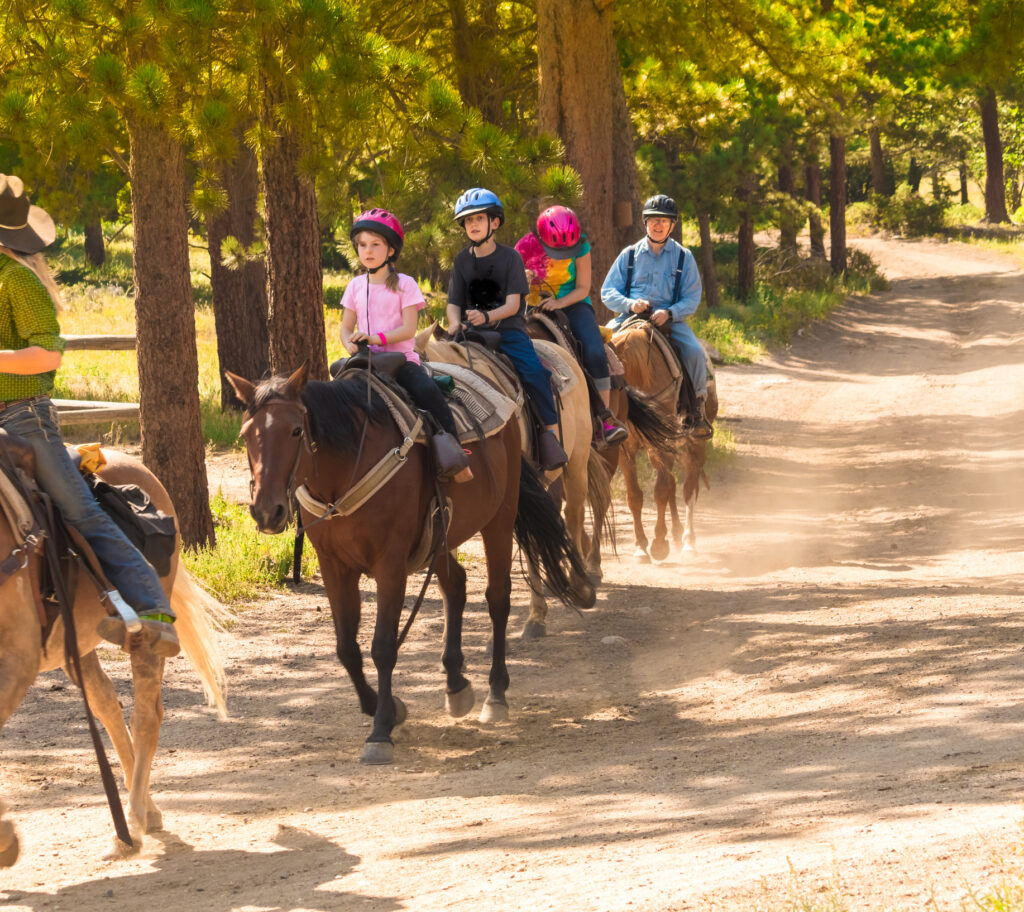 kids taking a horseback ride