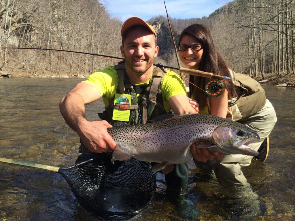 Couple fishing for trout at Harman's Luxury Log Cabins in West Virginia.