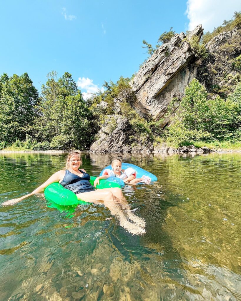 Guests at Harman's Log Cabin Resort floating along the North Fork River on inner tubes.
